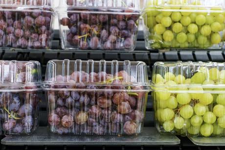 Grapes in punnets on supermarket shelves Adobe Stock