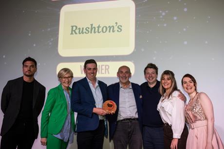 The Rushton's team accepts its award