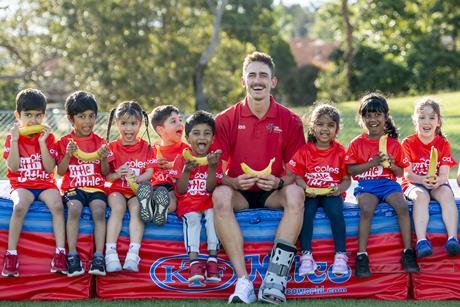 Brandon Starc with Tiny Tots for the Coles Banana A-Peel launch