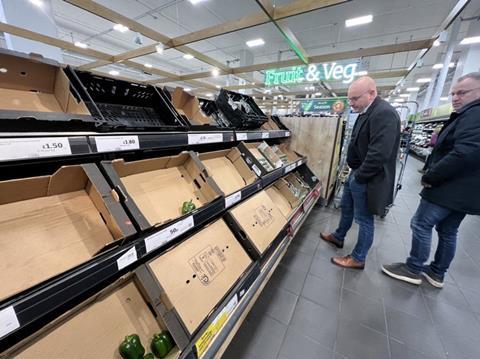 BelOrta's commercial director Jo Lambrecht inspects empty shelves at Sainsbury's in London
