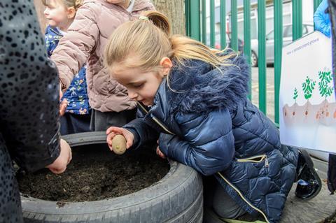 Children growing their own potatoes