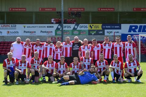 Simon Telfer, HR  director, with the staff football team from the Branston office and fresh factory at the Lincoln site