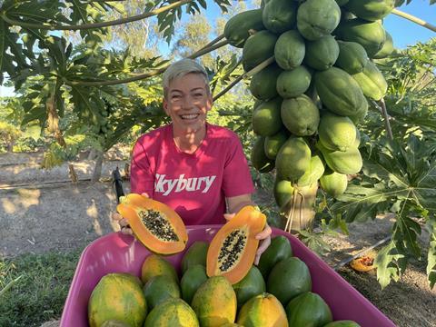 Candy MacLaughlin of Skybury Farms with a papaya
