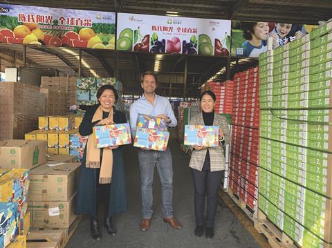 Global Produce owner Rutger van Wulfen (centre) with customers in Zhengzhou, China