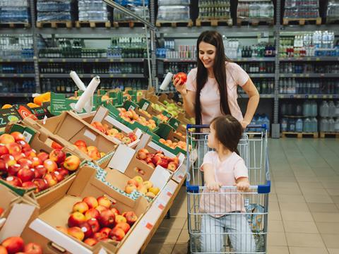 Healthy eating grocery store supermarket mum daughter fruit apples