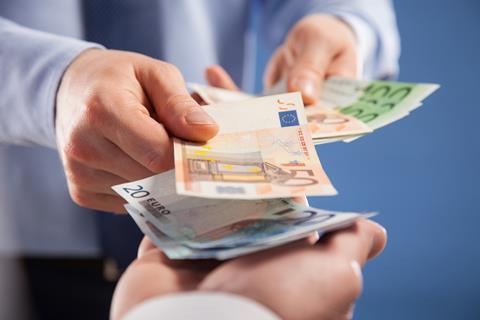 Euros payment handover Adobe Stock