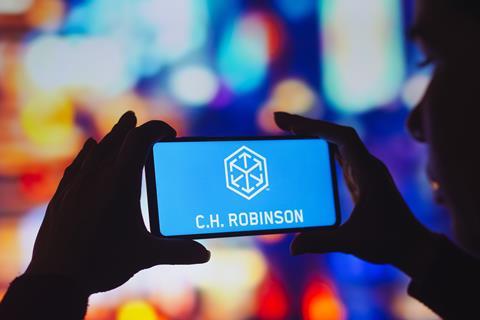 CH Robinson logo on phone MUST CREDIT Rafael Henrique Adobe Stock