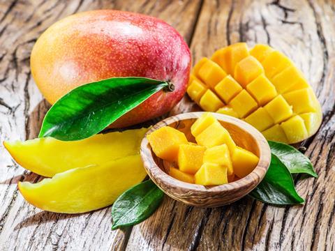 Mangoes on table cut sliced Adobe