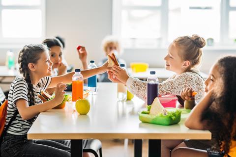 Children eating at school Adobe