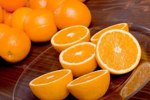 Generic Navel oranges on table some cut
