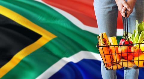 South Africa fresh produce basket in front of flag