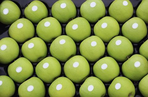 Blank stickers on green apples