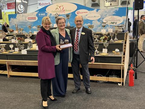 Minette Batters receives her award from Sarah Calcutt and John Guest