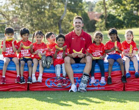 Brandon Starc with Tiny Tots for the Coles Banana A-Peel launch