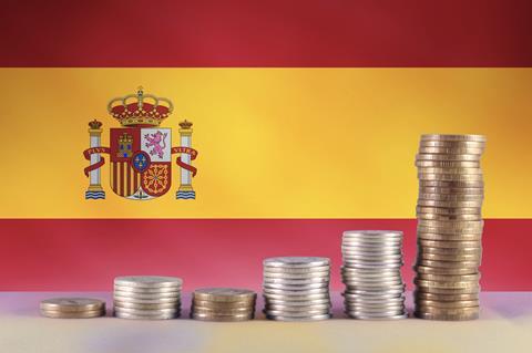 Spain flag money stacked Adobe Stock