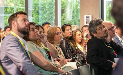 Audience members take in the insights at the Summit in Chile