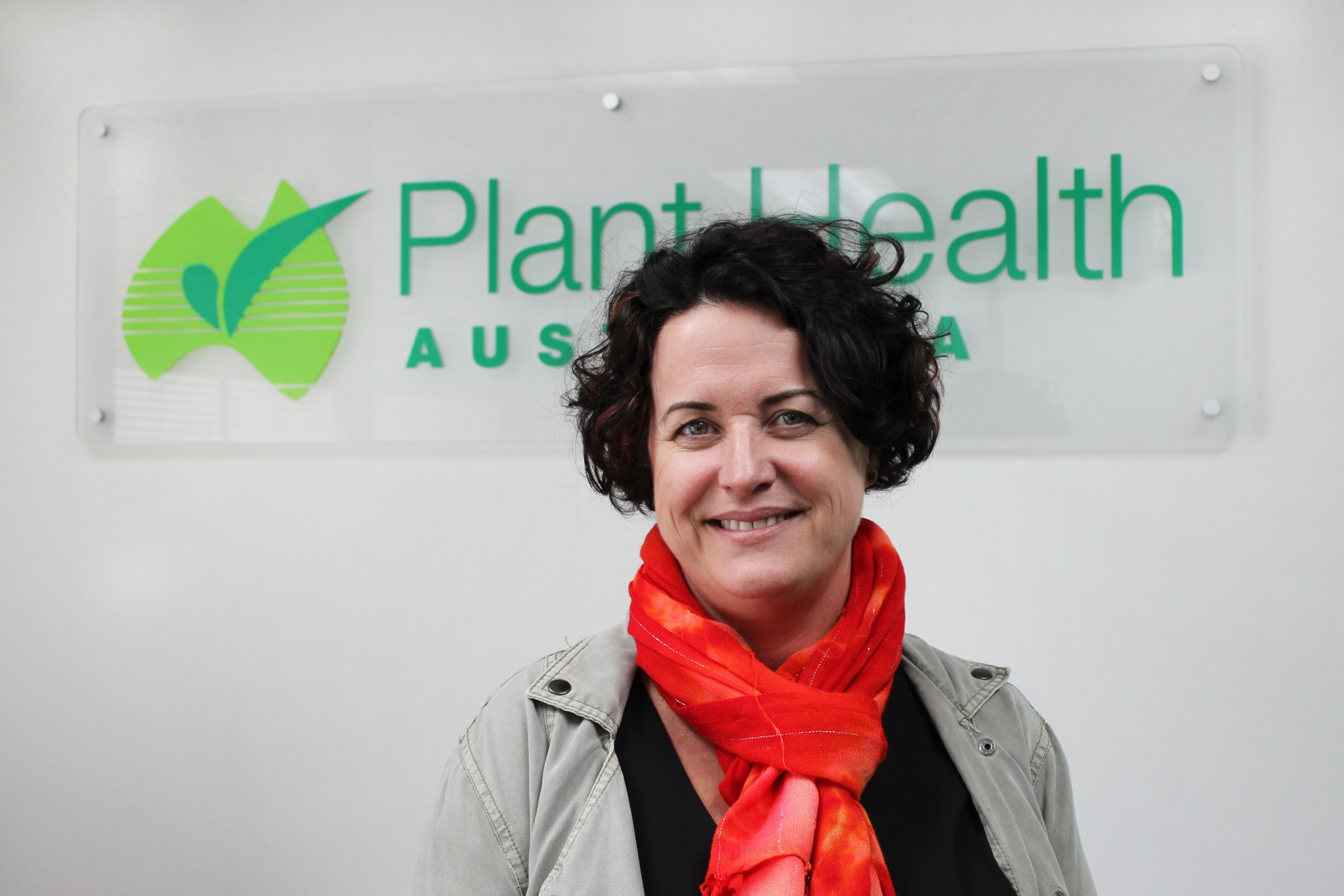 Sarah Corcoran with PHA sign Credit Plant Health Australia